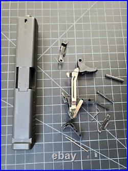 OEM Glock 23 Gen 3 complete slide OEM lower parts kit. 40 cal